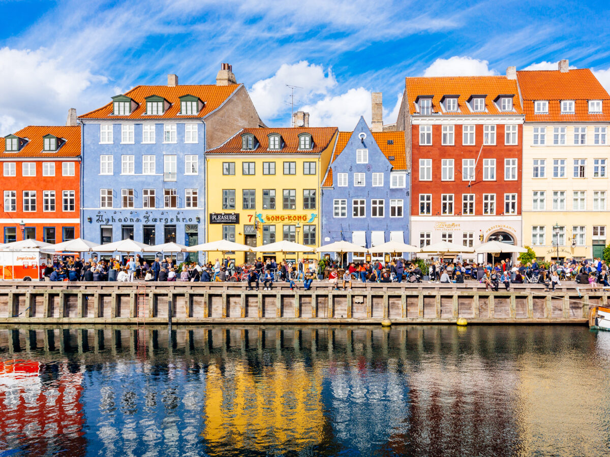 Multicolored houses along the canal in Nyhavn harbor, Copenhagen, Denmark