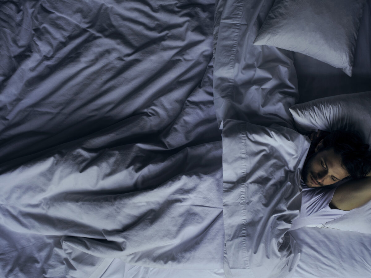 Man lying in bed