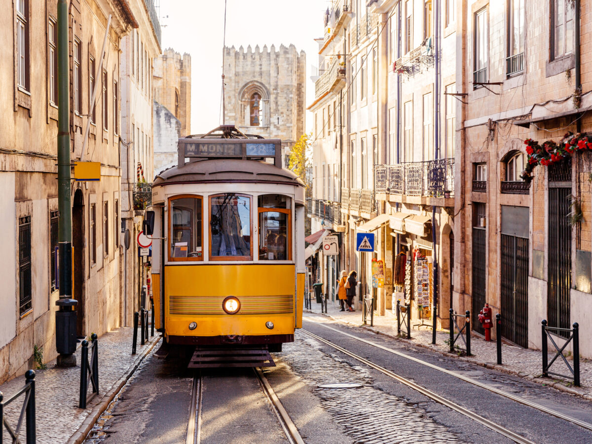 Yellow tram in Alfama, Lisbon, Portugal