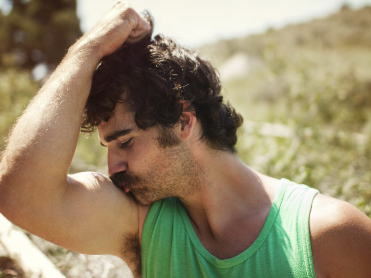 Man kissing bicep